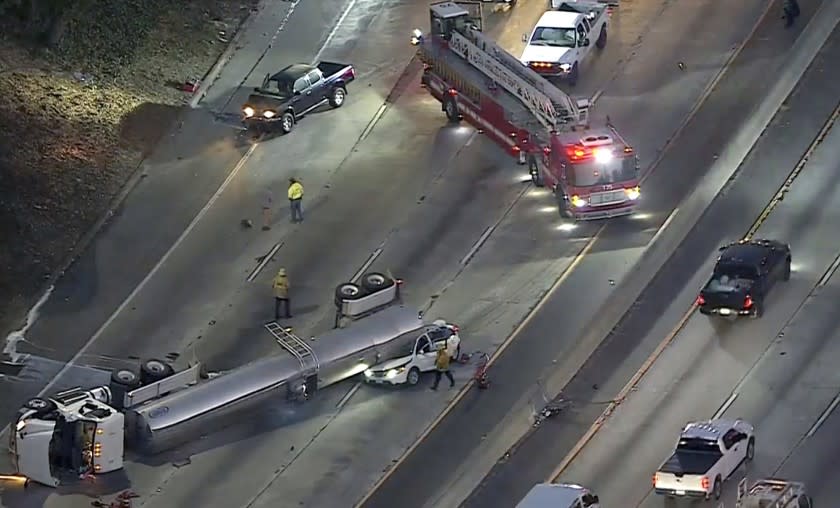 All lanes of the southbound Golden State (5) Freeway are closed at Main Street in Boyle Heights after a tanker overturned in a crash with another vehicle Tuesday morning, November24, 2020.