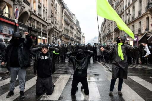 Police said at least 24 people had been detained in Paris, where 56,000 people marched toward the Saint-Lazare train station