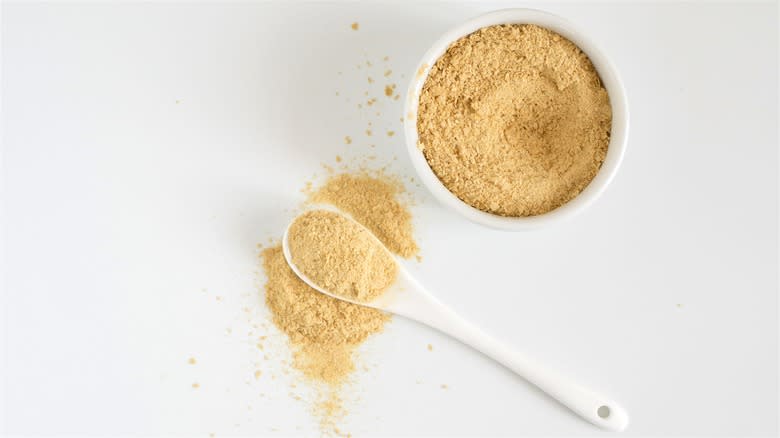 Spoonful and bowl of nutritional yeast