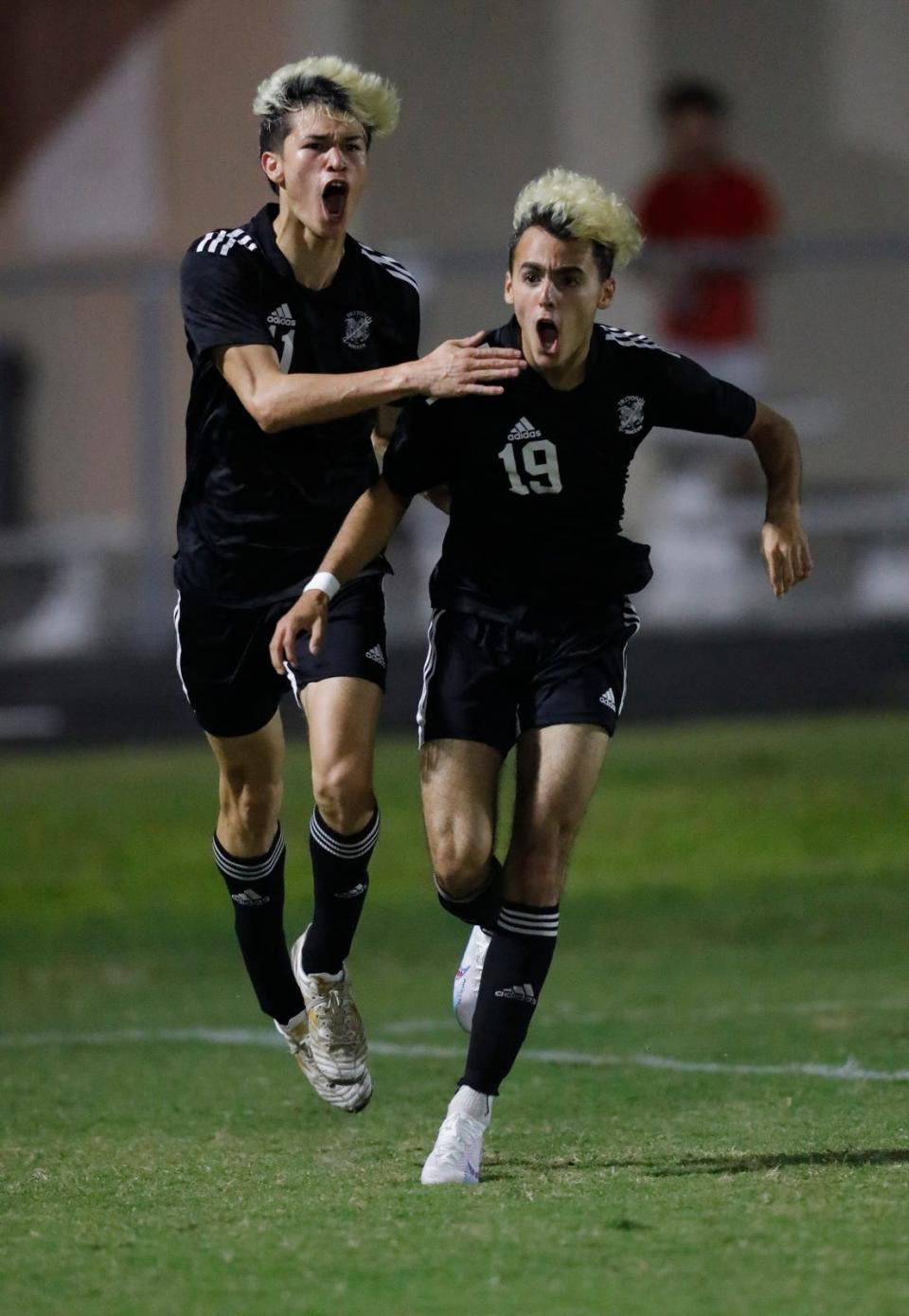 Mariner soccer player Lucas Tarra, left, congratulates teammate Marcel Tovar after he scored a goal against Cape Coral. The Mariner High School boys soccer team defeated Cape Coral Wednesday evening, February 1, 2023 to win the Class 5A District 11 championship. Mariner won with a final score of 3-0.