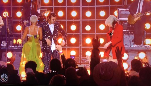 Miley Cyrus narrowly avoids a nip slip while going braless in a tracksuit  during SNL performance