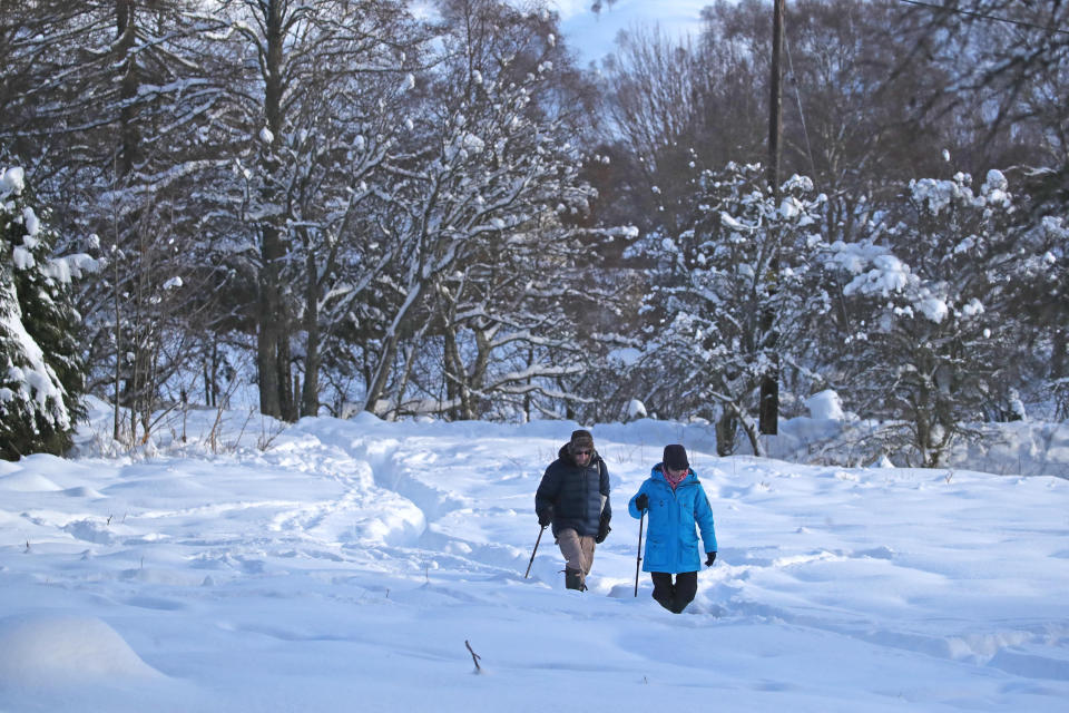 People walking in snowy conditions in Braemar, Aberdeenshire, which had an overnight temperature of minus 23.0C (minus 9.4F). The village, which is near Balmoral Castle, the summer residence of Queen Elizabeth II, recorded the lowest temperature in the UK in more than two decades, following an 