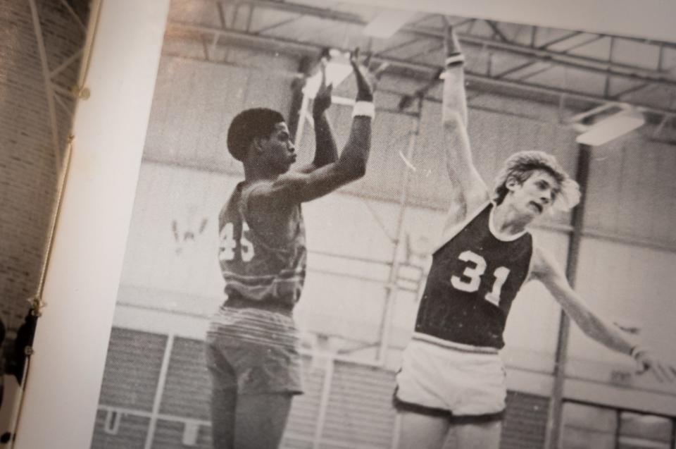 A photo of Johnston High Class of 1973 graduate Steven Lewis, left, playing basketball is seen in Pauline Garza's yearbook.