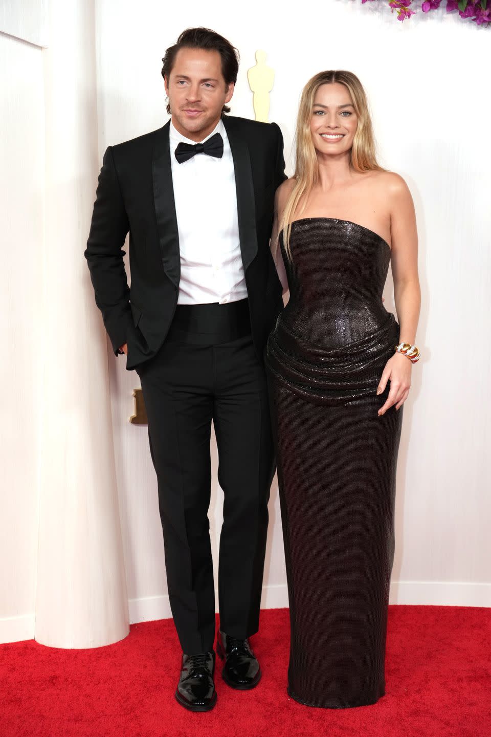 tom ackerley and margot robbie attend the 96th annual academy awards