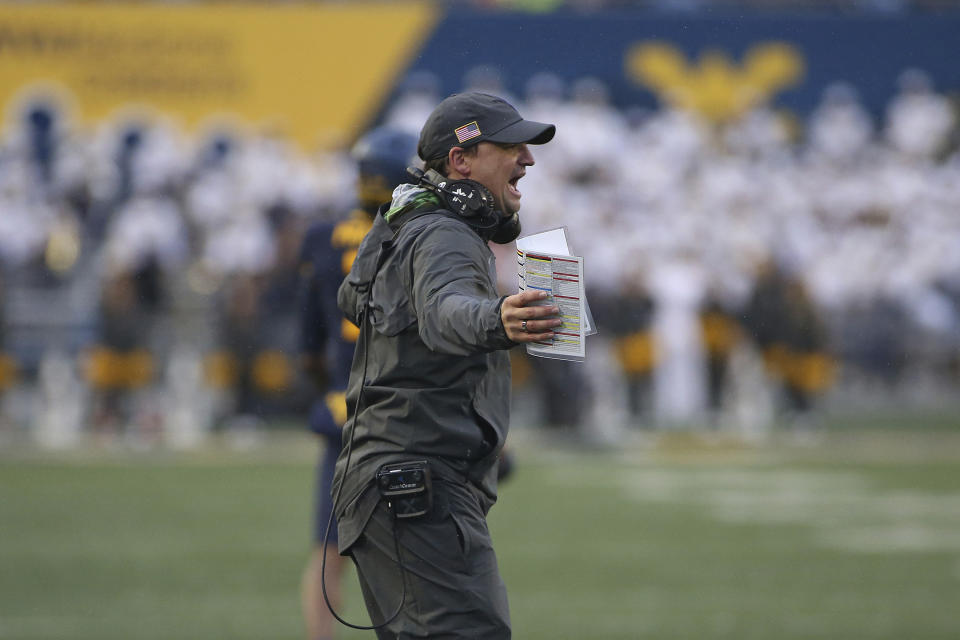 West Virginia coach Neal Brown reacts during the second half of an NCAA college football game against Oklahoma in Morgantown, W.Va., Saturday, Nov. 12, 2022. (AP Photo/Kathleen Batten)
