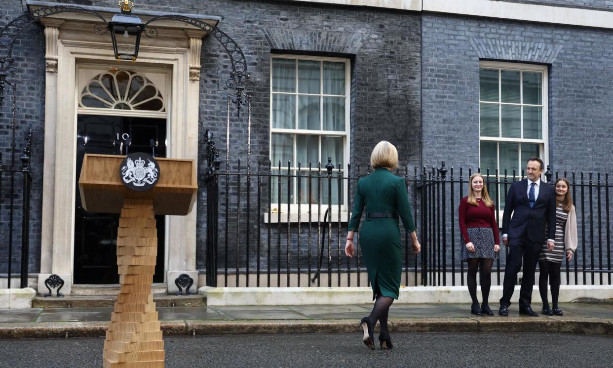 <span>Liz Truss walks towards her family on her last day as prime minister, 25 October 2022.</span><span>Photograph: Hannah McKay/Reuters</span>