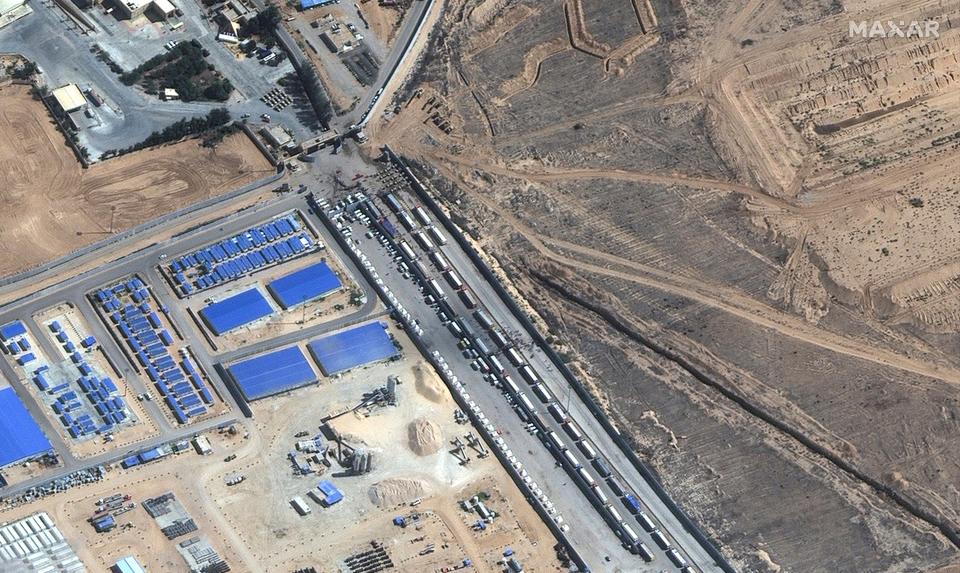 Aid trucks seen waiting on the Egyptian side of the Rafah border crossing on Friday (Maxar Technologies)