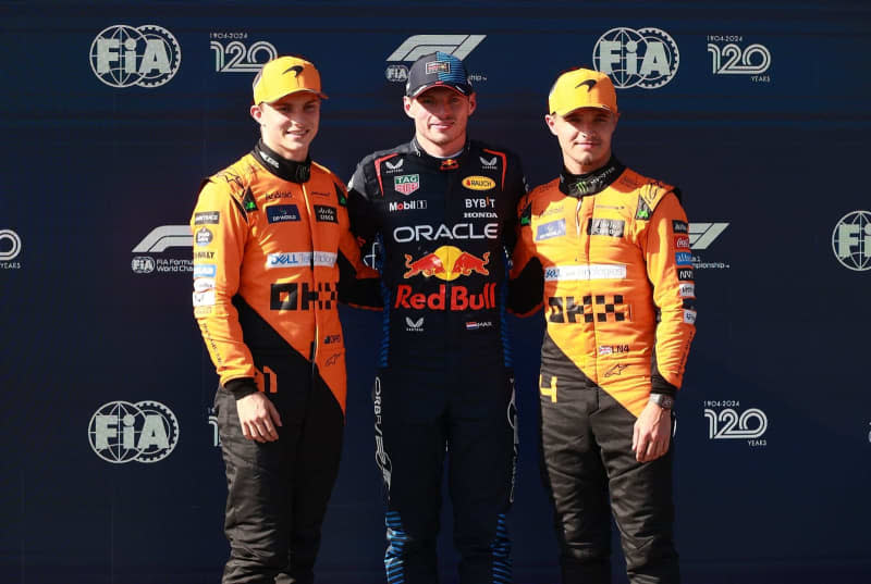 Dutch Formula One driver Max Verstappen of the Red Bull Racing team poses with Australian Oscar Piastri (L) from Team McLaren and British Lando Norris of Team McLaren after the qualifying sessions at the Autodromo  Internazionale Enzo e Dino Ferrari race track, ahead of the Formula One Emilia Romagna Grand Prix. Hasan Bratic/dpa