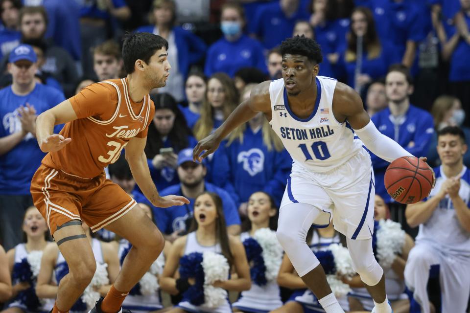 Seton Hall Pirates forward Alexis Yetna (10) dribbles as Texas Longhorns forward Brock Cunningham (30) defends during the first half at Prudential Center.