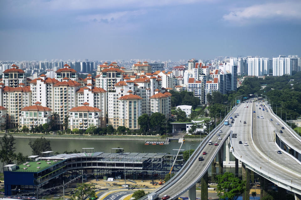 Vehicles travel on the Benjamin Sheares Bridge past the Marina Centre precinct and luxury waterfront condominiums of the Tanjong Rhu subzone in Singapore July 2, 2019. Picture taken July 2, 2019. REUTERS/Loriene Perera