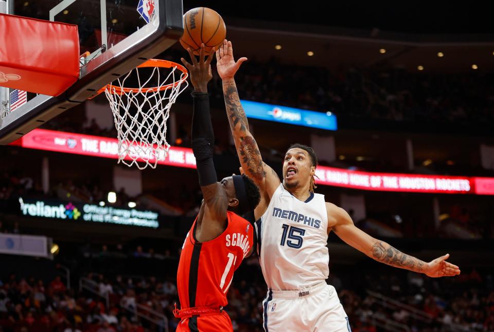 Mar 20, 2022; Houston, Texas, USA; Houston Rockets guard Dennis Schroder (17) shoots the ball as Memphis Grizzlies center Jon Teske (15) defends during the third quarter at Toyota Center. Mandatory Credit: Troy Taormina-USA TODAY Sports