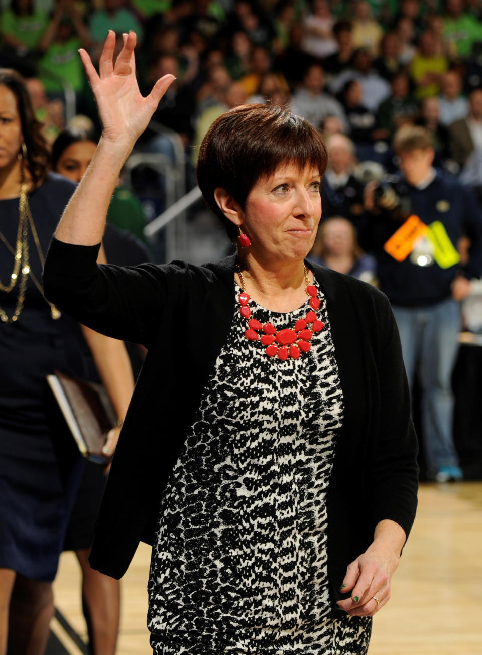 Notre Dame coach Muffet McGraw waves to the crowd prior to the first half of their NCAA women's college basketball tournament regional final game at the Purcell Pavilion in South Bend, Ind Monday March 31, 2014. (AP Photo/Joe Raymond)