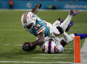 <p>Buffalo Bills cornerback Tre’Davious White (27) tackles Miami Dolphins wide receiver Jarvis Landry (14), during the second half of an NFL football game, Sunday, Dec. 31, 2017, in Miami Gardens, Fla. (AP Photo/Wilfredo Lee) </p>