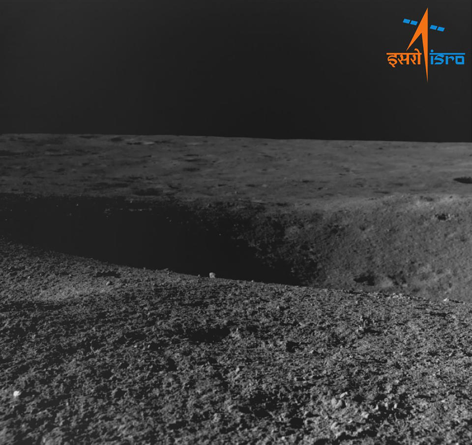This image provided by the Indian Space Research Organisation shows a crater encountered by Chandrayaan- 3 as seen by the navigation camera on Aug. 27, 2023. India's moon rover confirmed the presence of sulfur and detected several other elements near the lunar south pole as it searches for signs of frozen water nearly a week after its historic moon landing, India's space agency said Tuesday. The lunar rover had come down a ramp from the lander of India’s spacecraft after last Wednesday’s touchdown near the moon’s south pole. (Indian Space Research Organisation via AP)