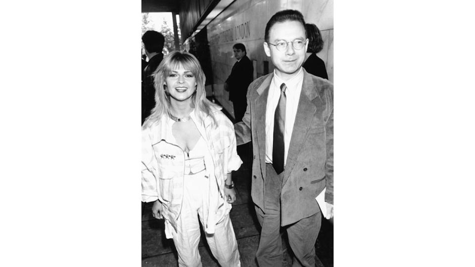 Black and white photo of Toyah Willcox in a white outfit and Robert Fripp in a suit