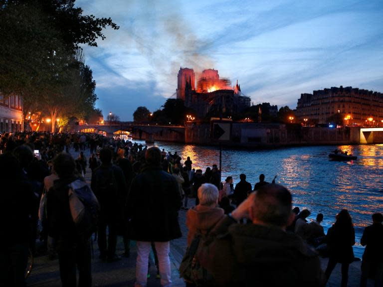 Notre Dame cathedral fire: Parisians lining Seine watch in disbelief as city’s beloved landmark is ravaged - ‘It was a symbol of France’