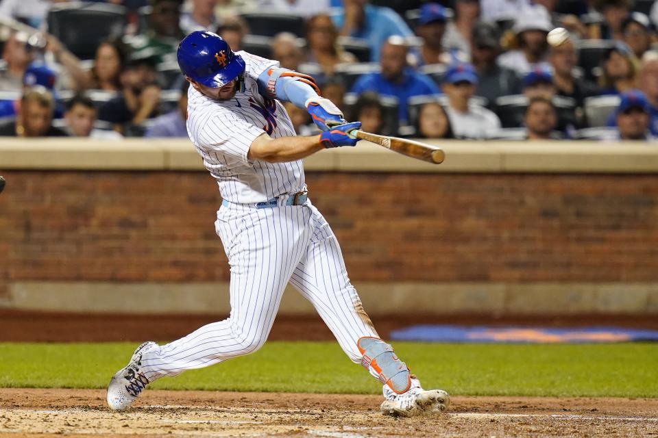 New York Mets' Pete Alonso hits a two-run home run during the third inning of a baseball game against the Colorado Rockies, Thursday, Aug. 25, 2022, in New York. (AP Photo/Frank Franklin II)