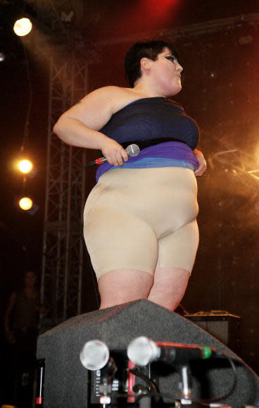 It's Beth Ditto! The Gossip singer looks like she became fed up with her dress and started taking it off!