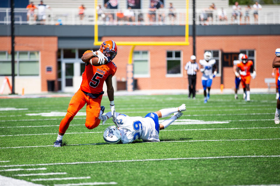 Hope's TJ McKenzie shakes off a defender during a game against Aurora Saturday, Sept. 3, 2022, at Ray and Sue Smith Stadium. 