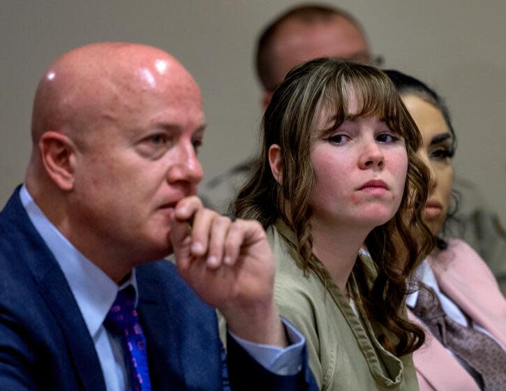 Hannah Gutierrez-Reed, center, sits with her attorney Jason Bowles and paralegal Carmella Sisneros during her sentencing hearing in Santa Fe, New Mexico, on Monday, April 15, 2024. Gutierrez-Reed, the armorer on the set of the Western film "Rust," was sentenced to 18 months in prison for involuntary manslaughter in the death of cinematographer Halyna Hutchins, who was fatally shot by Alec Baldwin in 2021. (Eddie Moore/The Albuquerque Journal via AP, Pool)