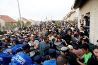 <p>Pro-settlement activists scuffle with Israeli police during an operation evict settlers from the West Bank settlement of Ofra, Tuesday, Feb. 28, 2017. REUTERS/Ronen Zvulun </p>