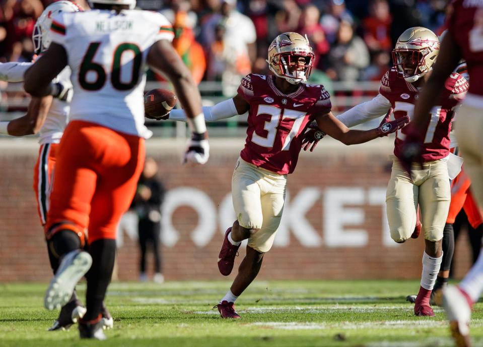 Florida State Seminoles defensive back Omarion Cooper (37 celebrates an interception against the Miami Hurricanes on Nov. 13, 2021. Cooper graduated from Lehigh High School.