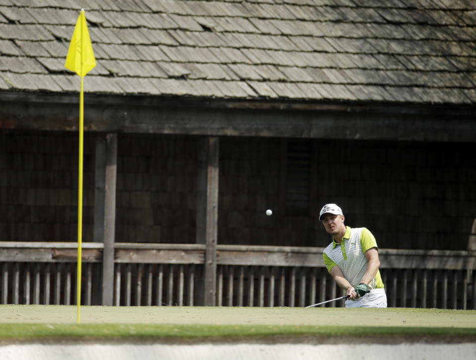 Jonas Blixt, of Sweden, hits out of a bunker on the 11th fairway during the second round of the Masters golf tournament Friday, April 11, 2014, in Augusta, Ga. (AP Photo/Charlie Riedel)