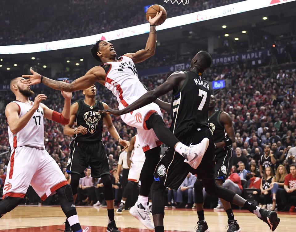 Toronto Raptors guard DeMar DeRozan (10) loses control of the ball as Milwaukee Bucks forward Thon Maker (7) defends during the first half of the opening game of an NBA basketball playoff series, in Toronto on Saturday, April 15, 2017. (Frank Gunn/The Canadian Press via AP)