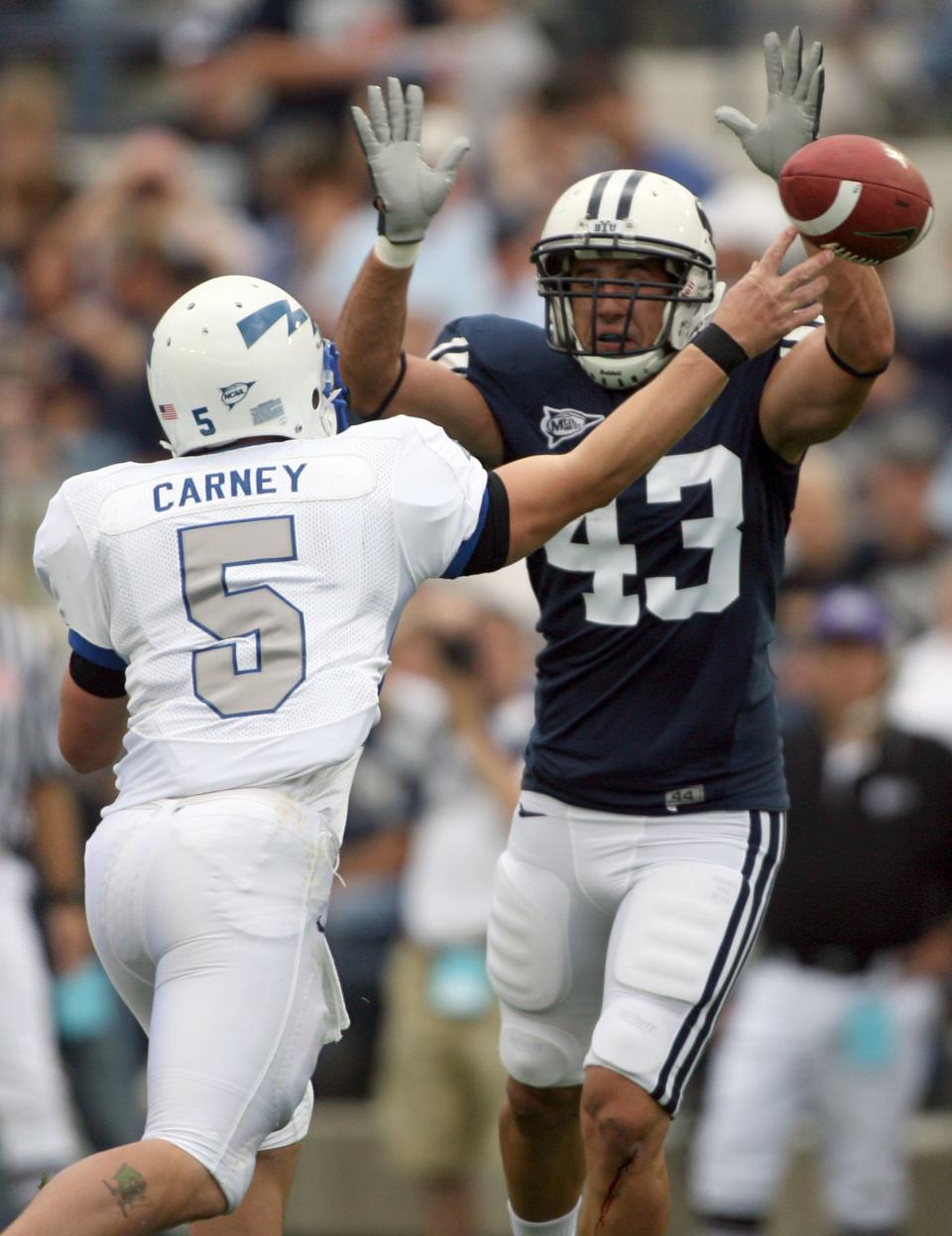 BYU’s David Nixon pressures Air Force QB Shaun Carney at LaVell Edwards Stadium in Provo on Saturday, Sept. 22, 2007. Nixon is an uncle to current Cougars John Henry Daley and Michael Daley. | Jason Olson, Deseret News