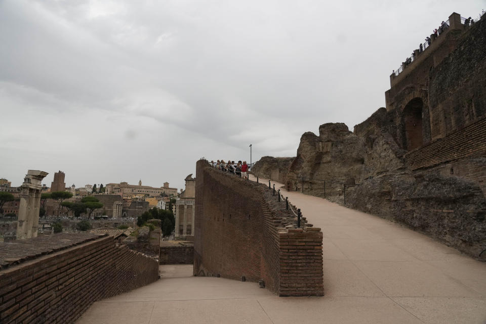 Visitors admire the newly restored domus Tiberiana, one of the main imperial palaces, during the press preview on Rome's Palatine Hill, in Rome, Italy, Wednesday, Sept. 20, 2023. The Domus Tiberiana will reopen to the public on Sept. 21. (AP Photo/Gregorio Borgia)