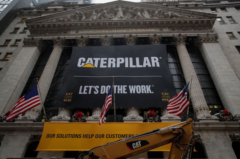 A banner for Caterpillar Inc. hangs on the facade of at the NYSE in New York