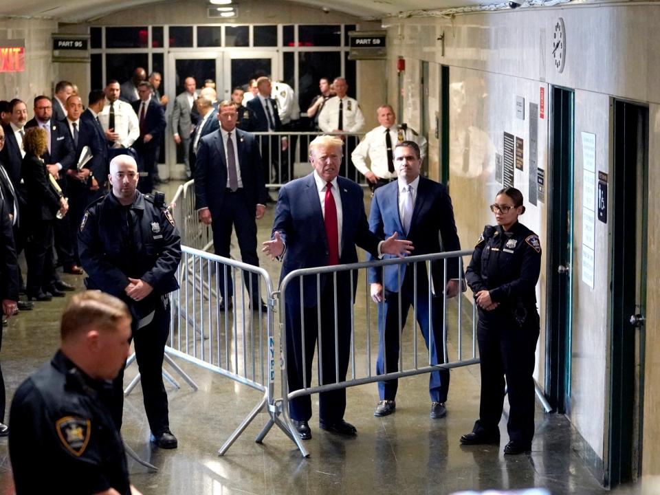 Donald Trump speaking to press hallway criminal Manhattan