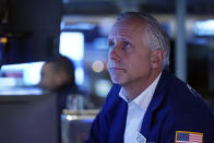 Specialist Donald Himpele Jr. works at his post on the floor of the New York Stock Exchange, Wednesday, Dec. 1, 2021. Wall Street has investors on another roller-coaster ride Wednesday, as an early stock market rally lost steam in afternoon trading. (AP Photo/Richard Drew)