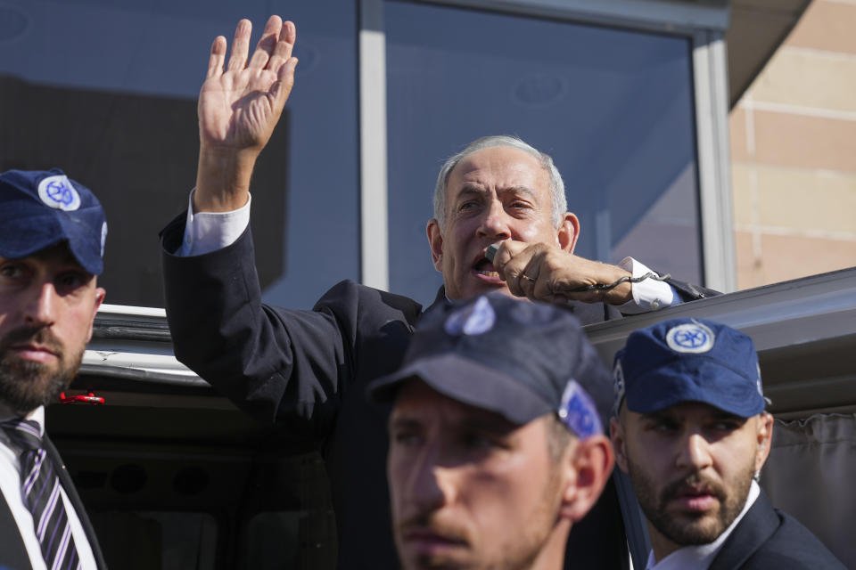 Benjamin Netanyahu, former Israeli Prime Minister and the head of Likud party, waves to his supporters during a national election, in Ashkelon, Israel, Tuesday, Nov. 1, 2022. (AP Photo/Tsafrir Abayov)
