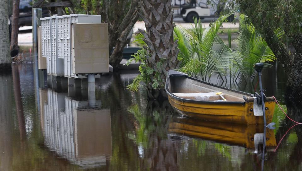 Two-plus weeks after Ian's deluge, small vessels, such as this jon boat tied up near mailboxes on Monday, remained necessary to get around Stone Island, a neighborhood prone to flooding in unincorporated Volusia County on Lake Monroe, just south of Deltona.