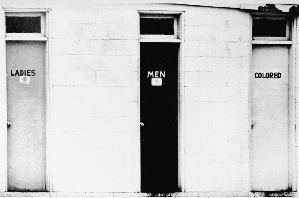 View of segregated public restrooms labelled 'ladies,' 'men' and 'colored,' USA, circa 1960.