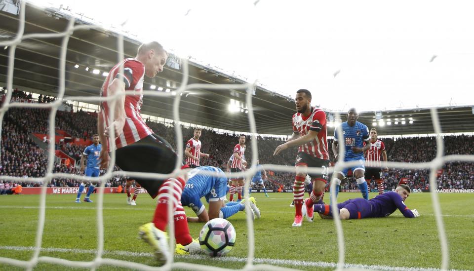 <p>Southampton’s Steven Davis clears off the line </p>