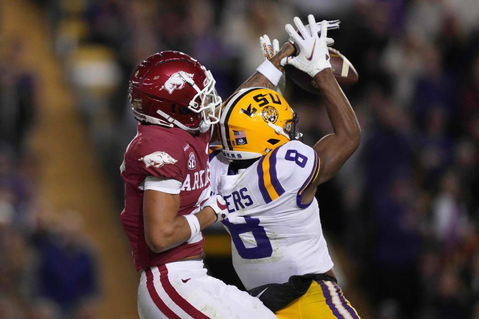 Nov 13, 2021; Baton Rouge, Louisiana, USA; Arkansas Razorbacks defensive back Myles Slusher (2) breaks up a pass intended for LSU Tigers wide receiver Malik Nabers (8)  in the first half at Tiger Stadium. Mandatory Credit: Kirby Lee-USA TODAY Sports