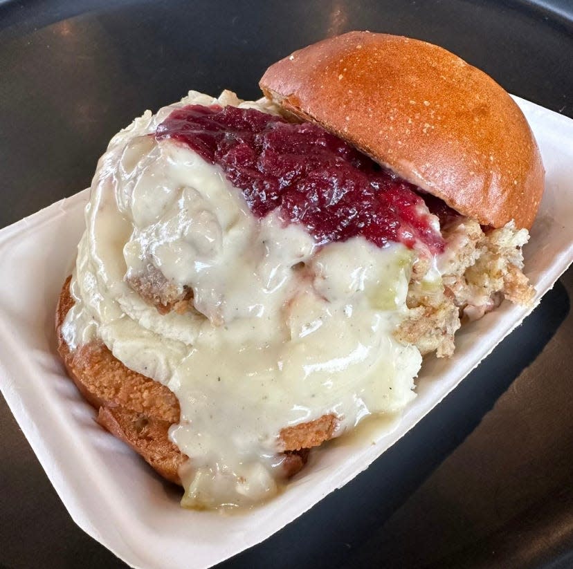 The seasonal vegan Gobbl'r special from Greens and Grains in Shrewsbury, including a plant based turk'y patty with house-made mashed potatoes, stuffing, and herb gravy topped with cranberry sauce on a vegan brioche bun.