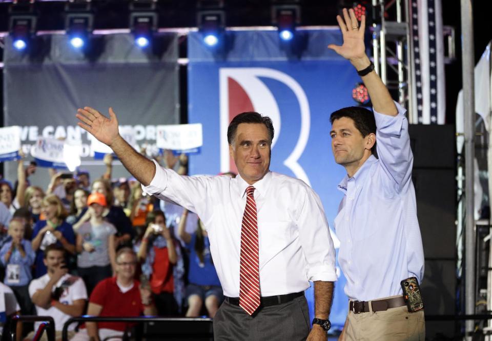 Republican presidential candidate and former Massachusetts Gov. Mitt Romney campaigns with his running mate Rep. Paul Ryan, R-Wis., in Fishersville, Va., Thursday, Oct. 4, 2012. (AP Photo/Charles Dharapak)