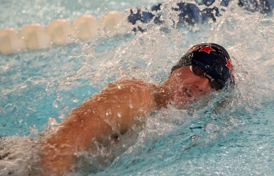 BNL senior captain John Allen cuts through the pool while winning the 100 freestyle against Floyd Central.