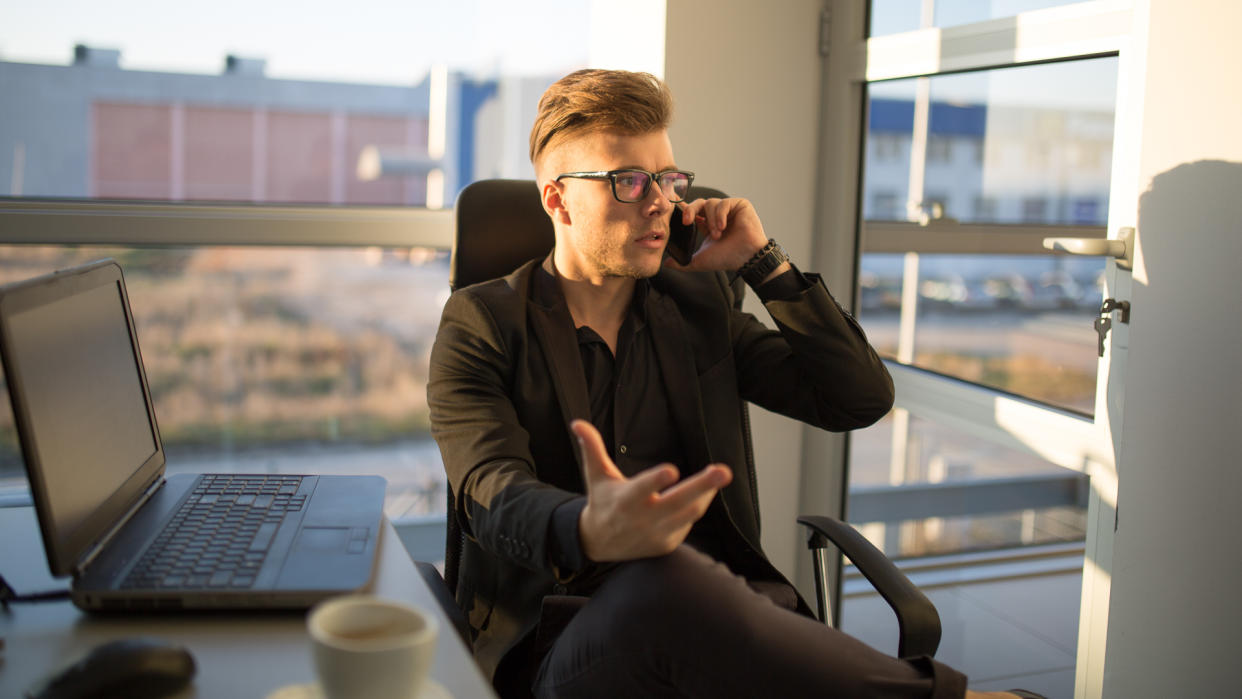 Young businessman on the phone.