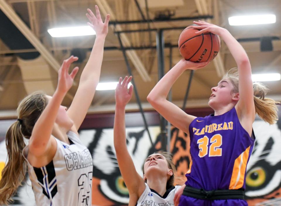 Flandreau's Claire Sheppard shoots a basket over the arms of Sioux Falls Christian's Kylah VanDonkersgoed during a class A state qualifying game on Thursday, March 4, 2021, at Harrisburg High School.