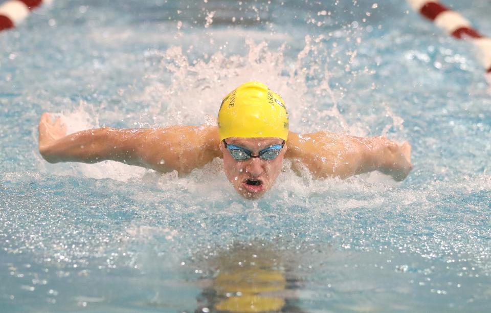 Firestone’s Jonny Marshall on his way to a first place finish in the 100 yard butterfly event at the Northeast Classic swim meet on Saturday, Jan. 15, 2022 in Canton, Ohio, at Branin Natatorium.