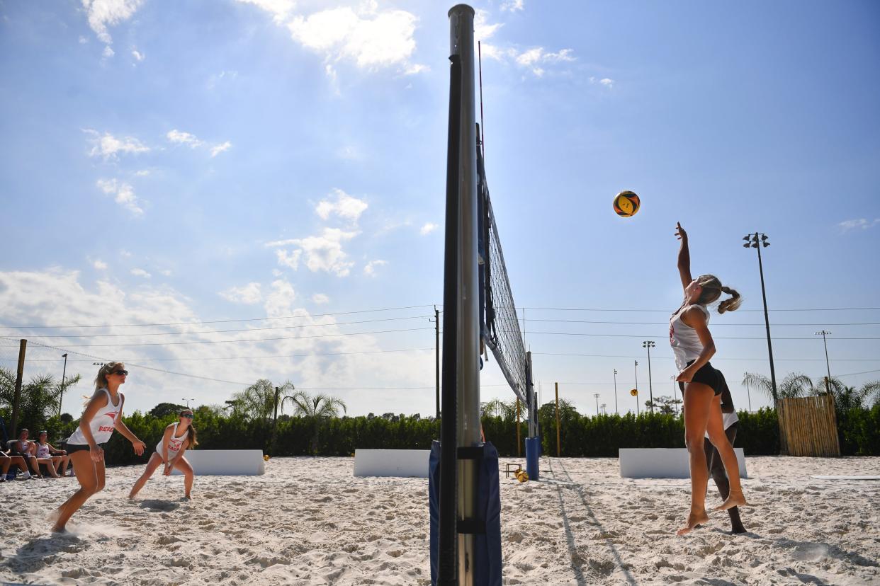 Cardinal Mooney beach volleyball players scrimmage during a recent practice. The Cougars won the SSAC title and reached the regionals in the FHSAA tournament.