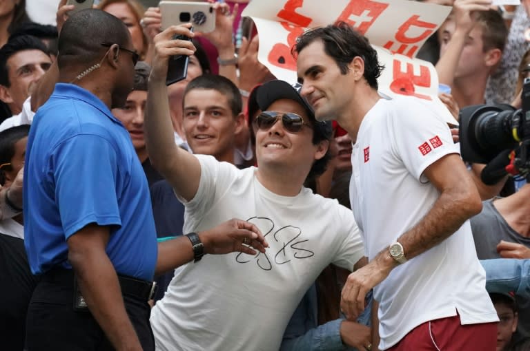 Picture this: Roger Federer takes a selfie with a fan after beating Nick Kyrgios