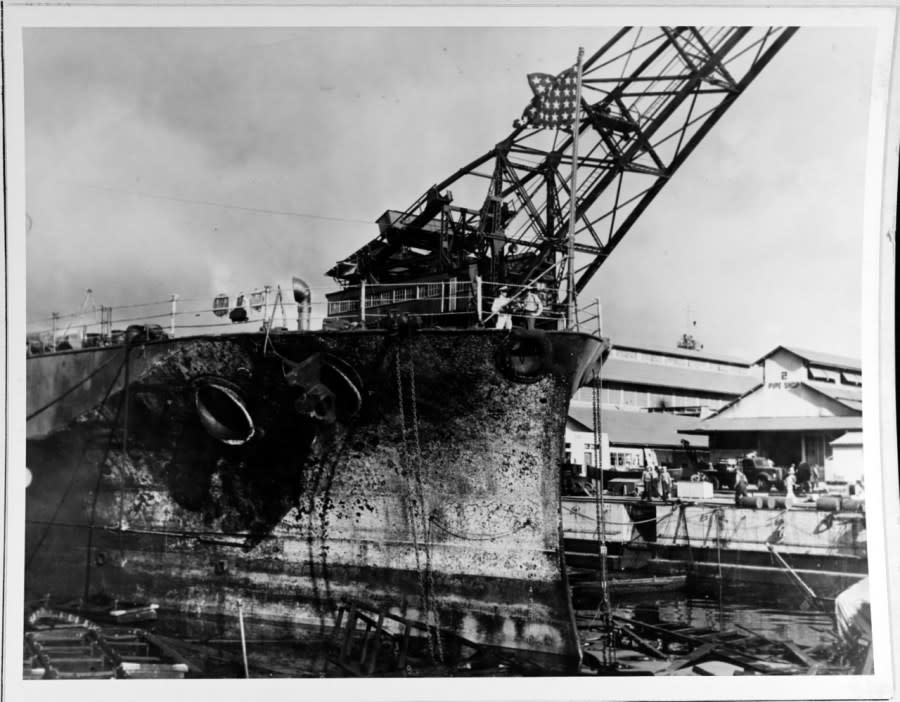 Blistered paint and other fire damage to the forward hull of USS Pennsylvania (BB-38), in Drydock # 1 at the Pearl Harbor Navy Yard shortly after the Japanese raid. Note Jack flying at the battleship’s bow. (Official U.S. Navy Photograph, from the collections of the Naval History and Heritage Command)