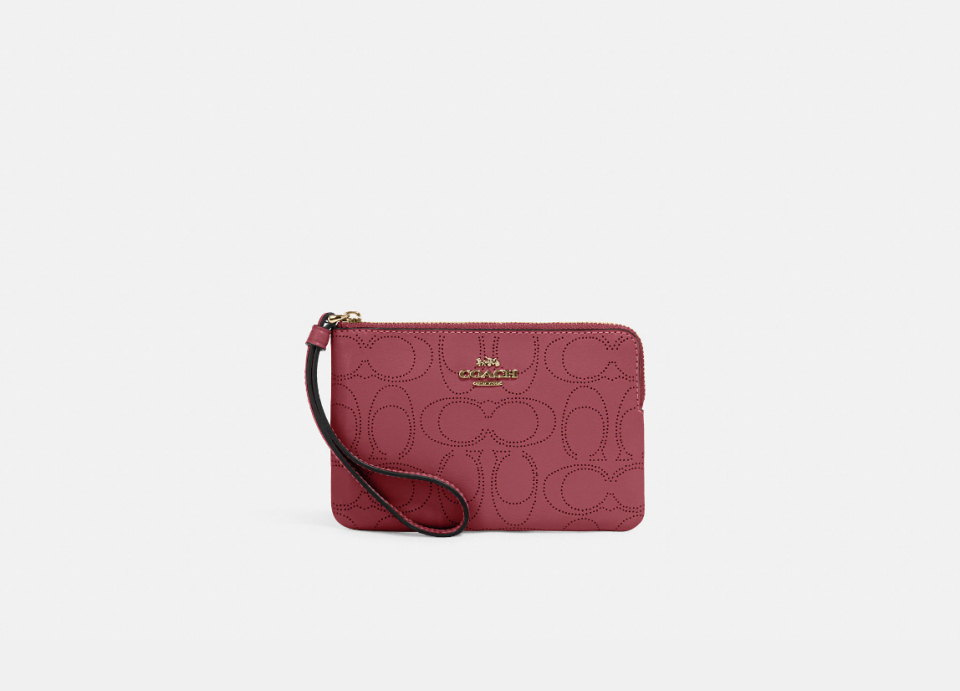 Corner Zip Wristlet in gold/rouge (Photo via Coach Outlet)