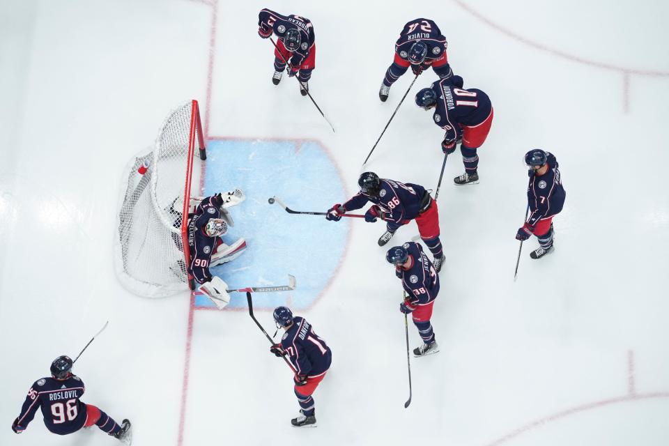 Nov 9, 2023; Columbus, Ohio, USA; Columbus Blue Jackets left wing Kirill Marchenko (86) shoots at goaltender Elvis Merzlikins (90) during warm-ups prior to the NHL hockey game against the Dallas Stars at Nationwide Arena.