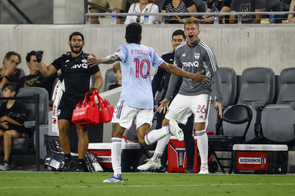 FC Dallas forward Jesus Ferreira (10) celebrates his goal against Los Angeles FC with defender Lucas Bartlett (26) during the first half of an MLS soccer match in Los Angeles, Wednesday, June 29, 2022. (AP Photo/Ringo H.W. Chiu)